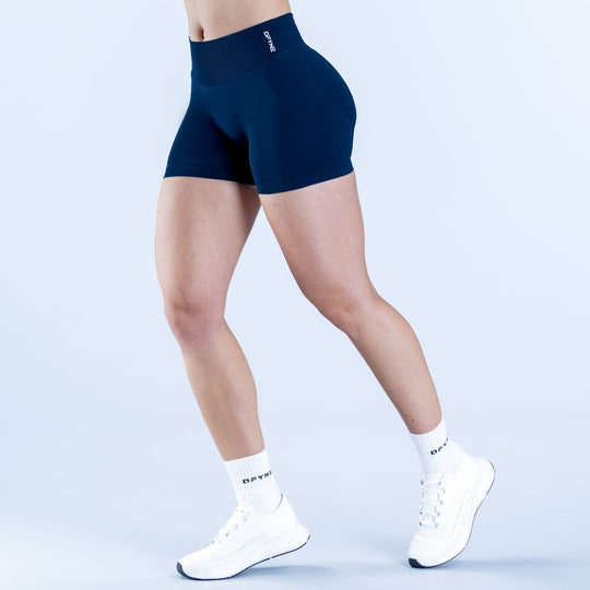 Dark navy 4.5-inch impact shorts, high-rise compression fit, small side logo