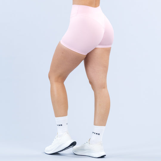 Pink 4.5-inch athletic shorts, back/side view with smooth stretch fabric