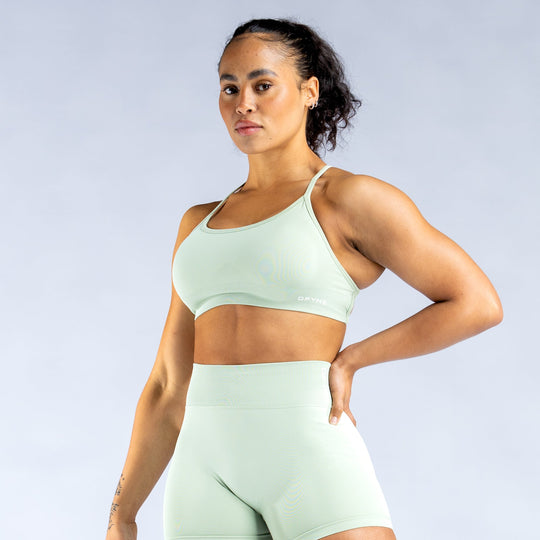 Mint green backless sports bra with crisscross open-back straps