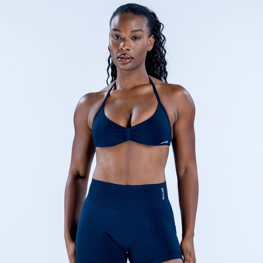 Front view dark navy strappy bra with V-neck and gathered center seam