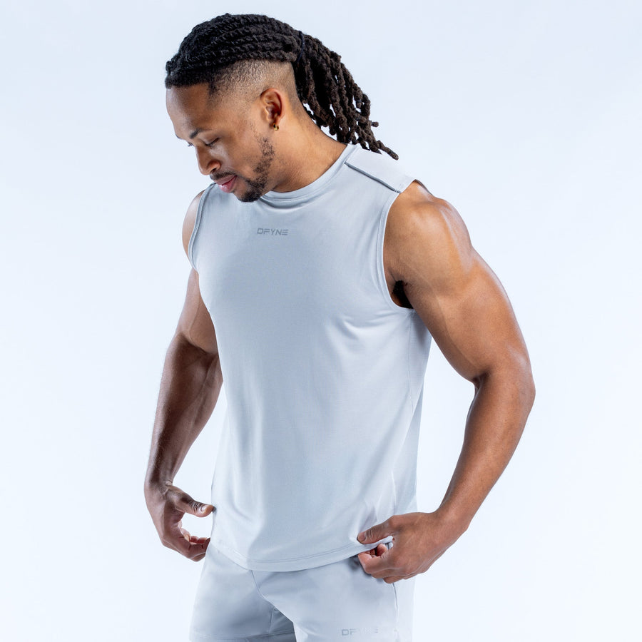 Light blue sleeveless tank top with crew neck, small logo on chest