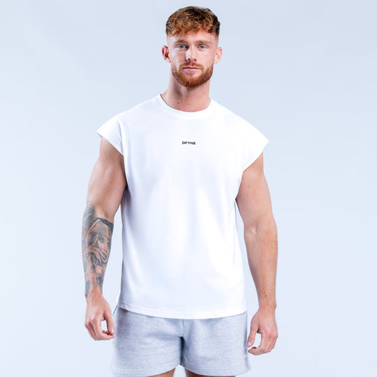 White sleeveless tank top with small stylized logo on the chest