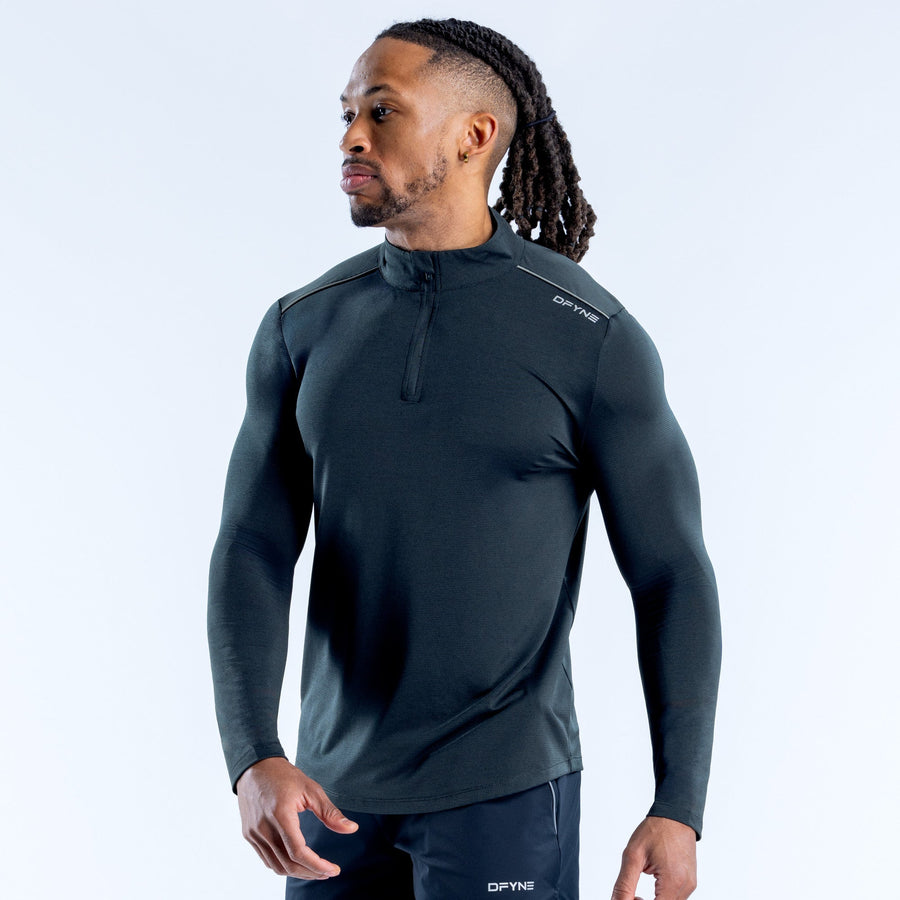 Dark quarter-zip athletic pullover with stand collar and long sleeves, side view