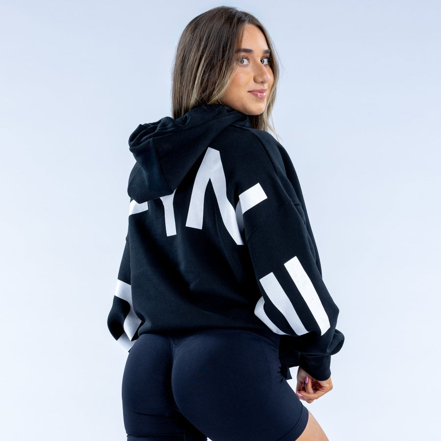 Dark navy hoodie with large white back print and kangaroo pocket, hood down.