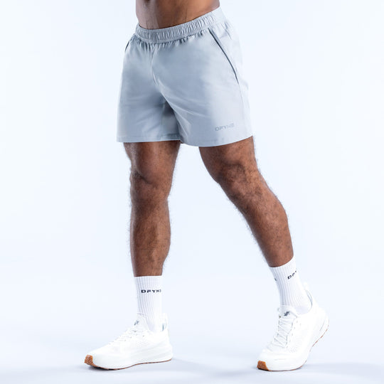 Light blue training shorts, 6-inch inseam, elastic waistband with small logo