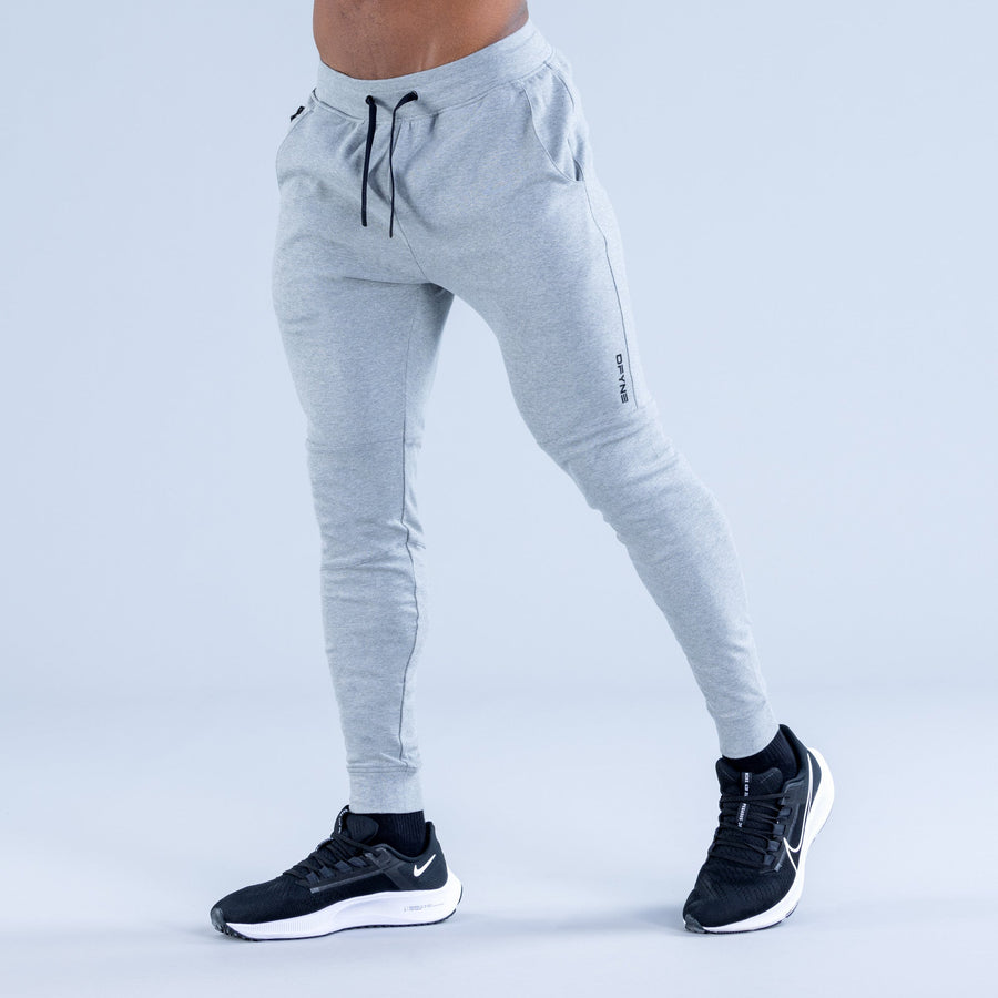 Light gray tapered jogger pants with drawstring waist and side pockets