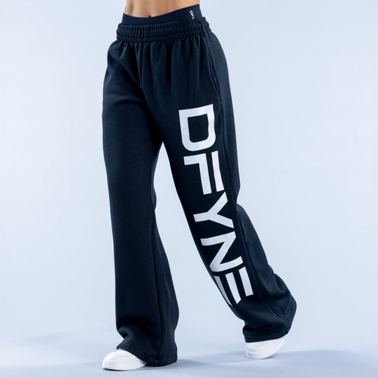 Dark navy wide-leg jogger pants with elastic waistband and large front graphic logo