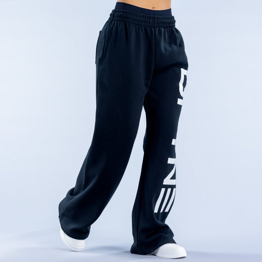Dark navy wide-leg jogger pants with white side lettering logo on open leg