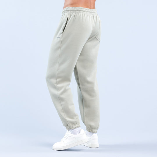 Light sage jogger pants with relaxed tapered legs, elastic waistband, cuffed hem