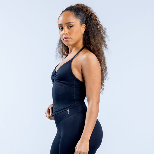 Dark navy longline strappy halter top with ruched front and fitted side silhouette.