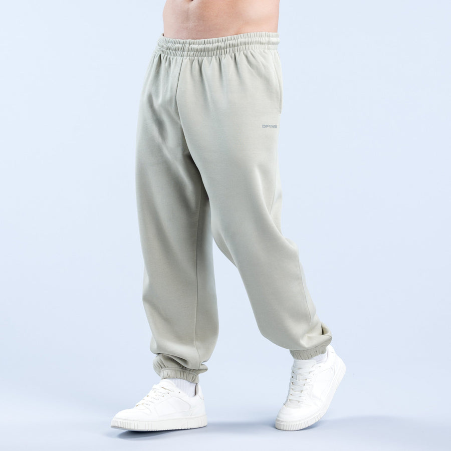 Light sage jogger pants with relaxed fit, elastic waistband, ribbed ankle cuffs