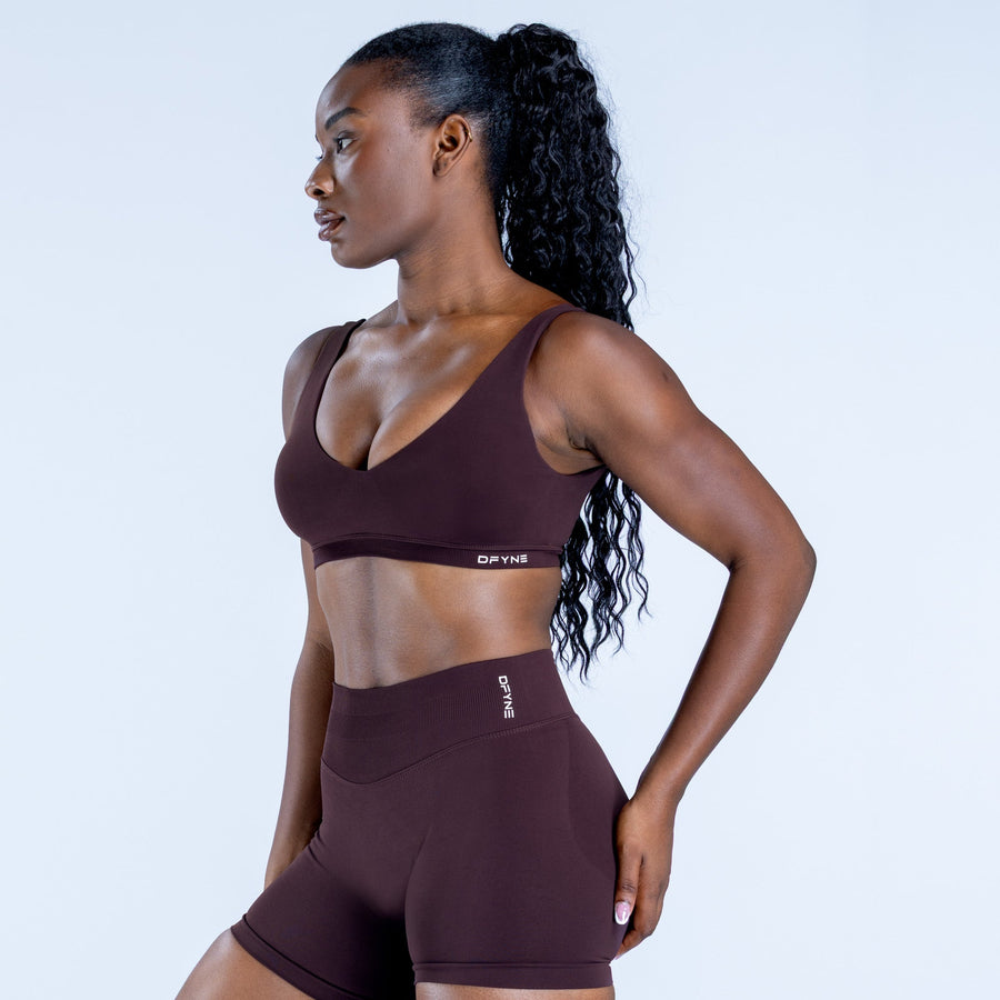 Impact scoop-back sports bra, dark maroon, side profile with scoop neckline