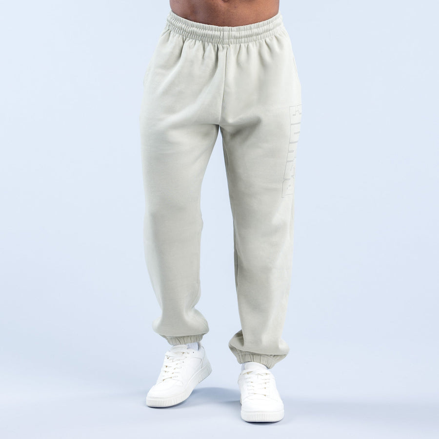 Cream graphic joggers with elastic waistband and ribbed cuffs
