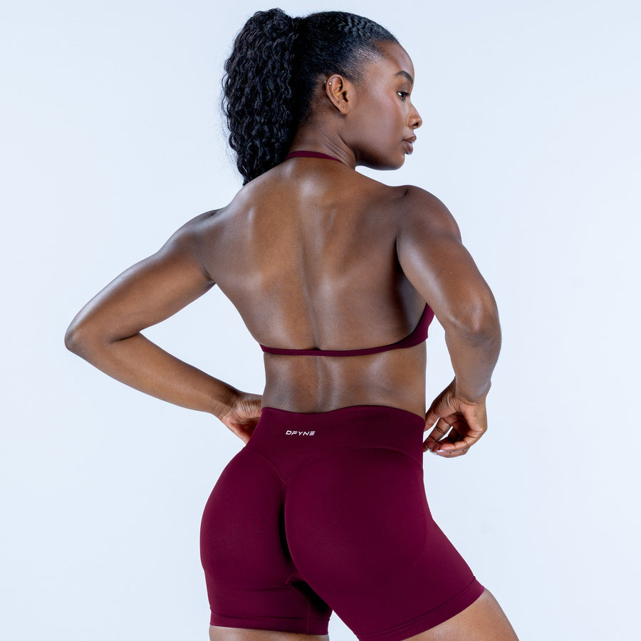 Impact strappy bra back view with thin maroon straps and open back
