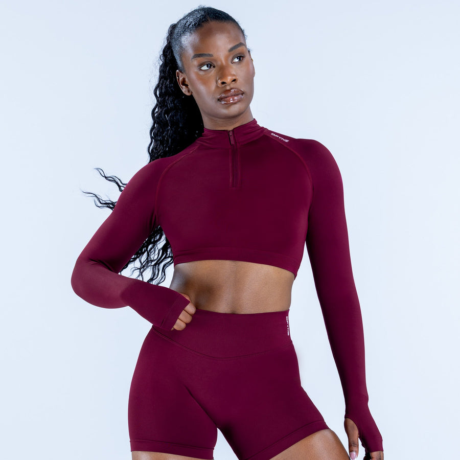 Burgundy long-sleeve zip-front crop top and high-waist shorts set, front view