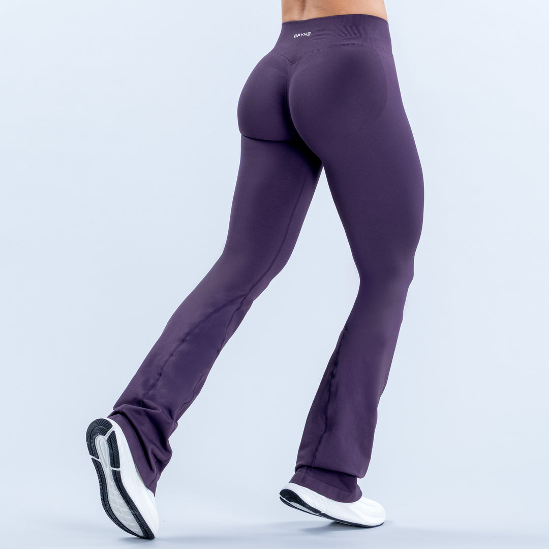 Purple flared leggings with a high waist, shown from the back