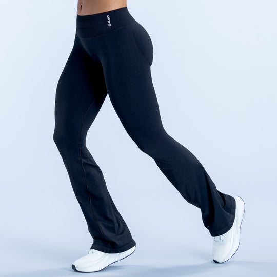 High-waist dark leggings with wide flare hem and subtle seam lines