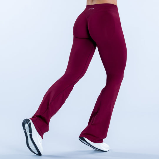 Impact flares in deep burgundy, fitted design with flared leg openings