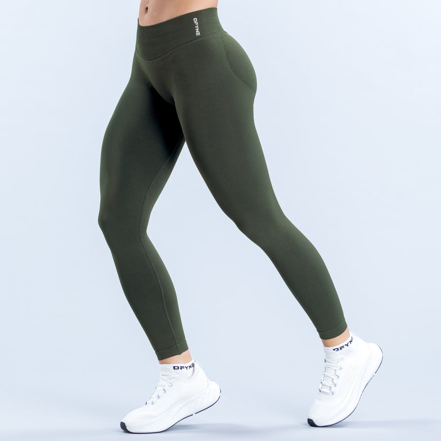 Dark olive high-waisted leggings with a wide waistband and ankle-length legs, shown from the front.