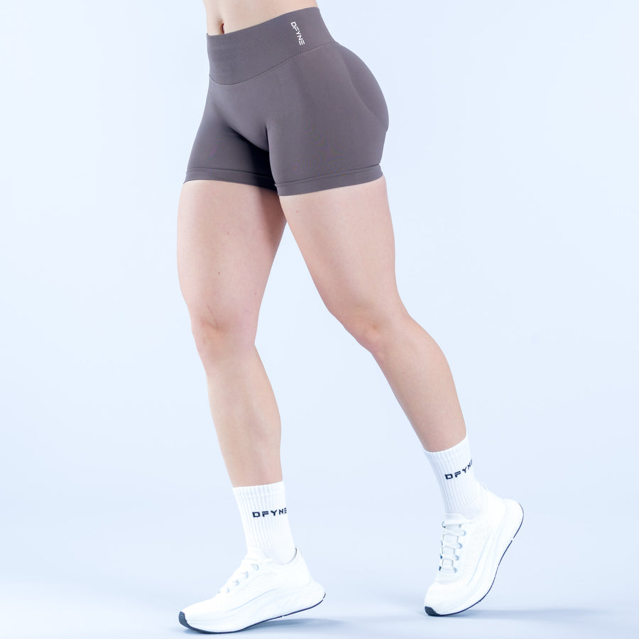 Dark gray 4.5-inch impact shorts with elastic waistband, front logo detail.
