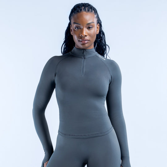Fitted charcoal gray long-sleeve half-zip athletic pullover with stand collar