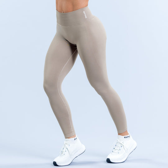 Women's light taupe leggings with waistband logo and full-length fit