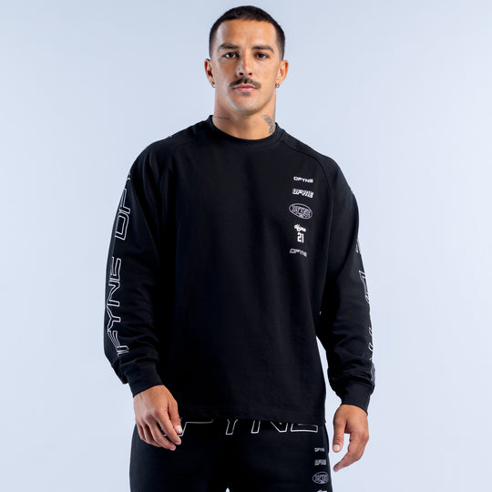 Black long-sleeve crewneck top with white sleeve lettering and small chest logos