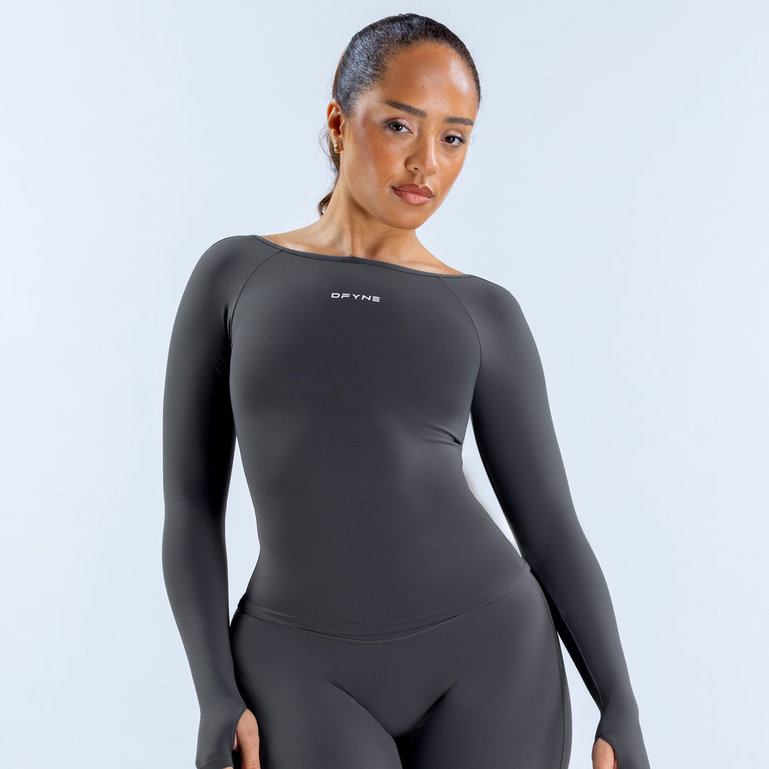 Charcoal long sleeve scoop neck top with a fitted silhouette and small chest logo