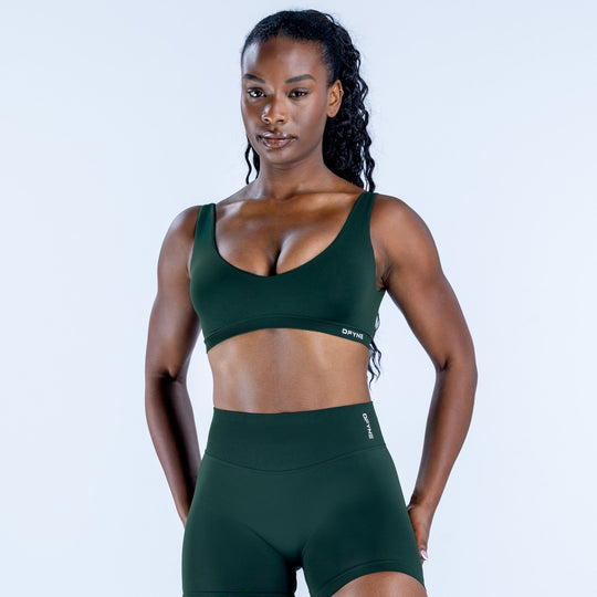 Impact scoop back sports bra in dark green with wide straps and stretch fit