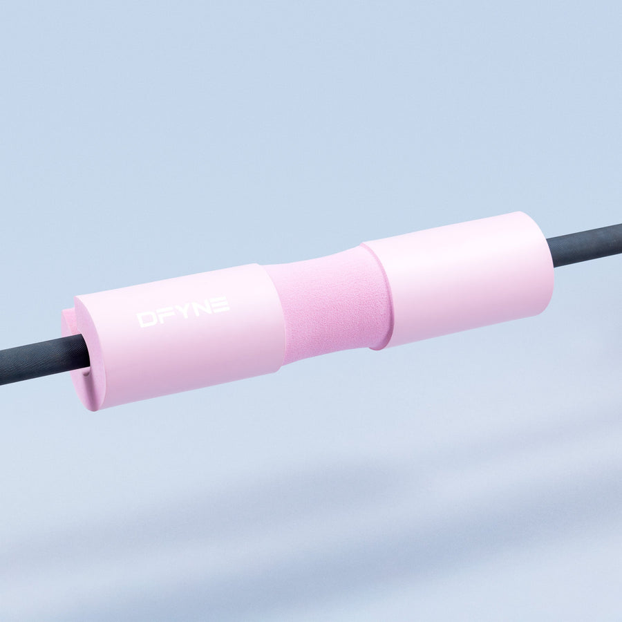 Barbell pad with foam sleeve, pink cover, and snug fit for standard barbells