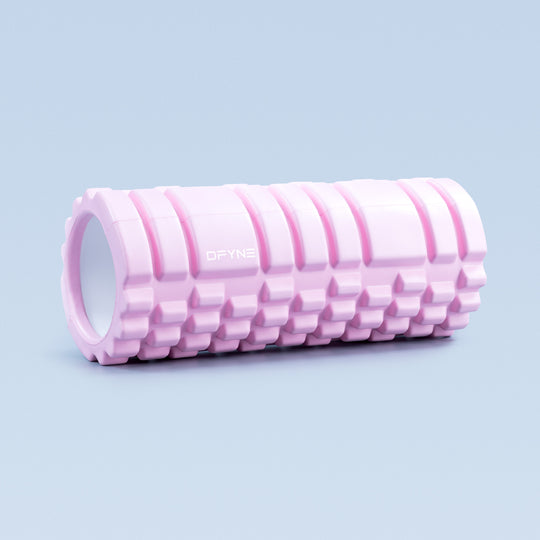 Pink foam roller with hollow core and ridged surface texture, DRYNE logo