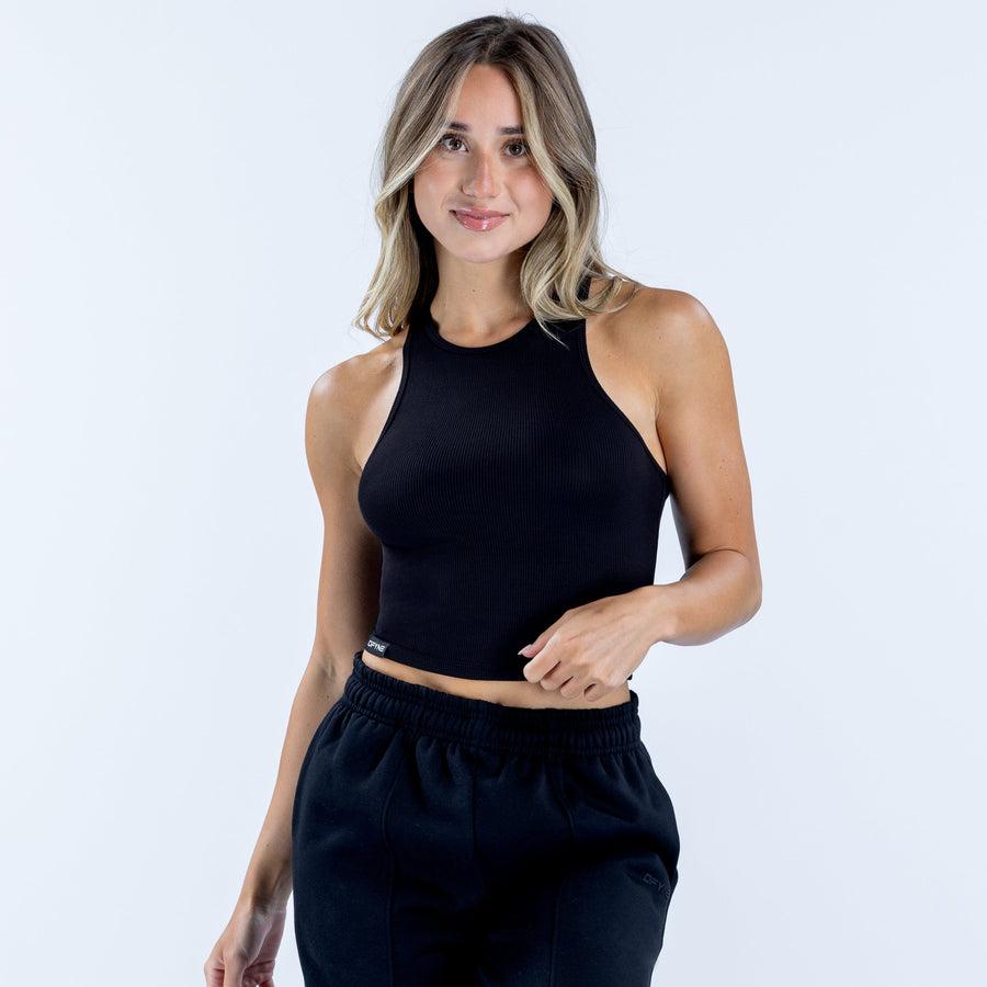Ribbed sleeveless vest in dark navy with high neckline, fitted cropped cut