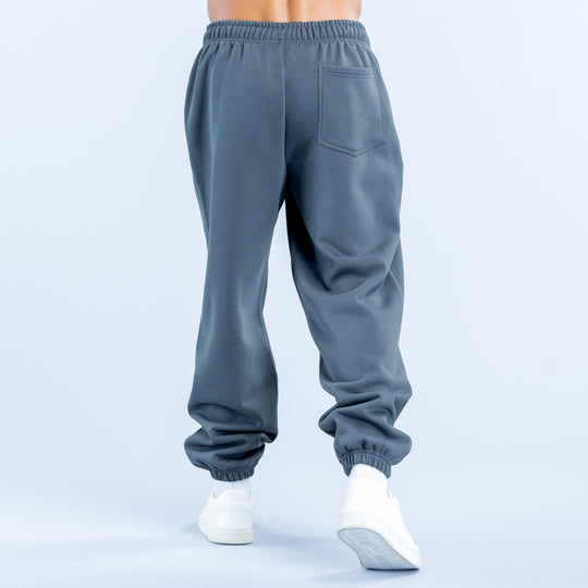Dark blue joggers back view with elastic waistband and back pocket detail
