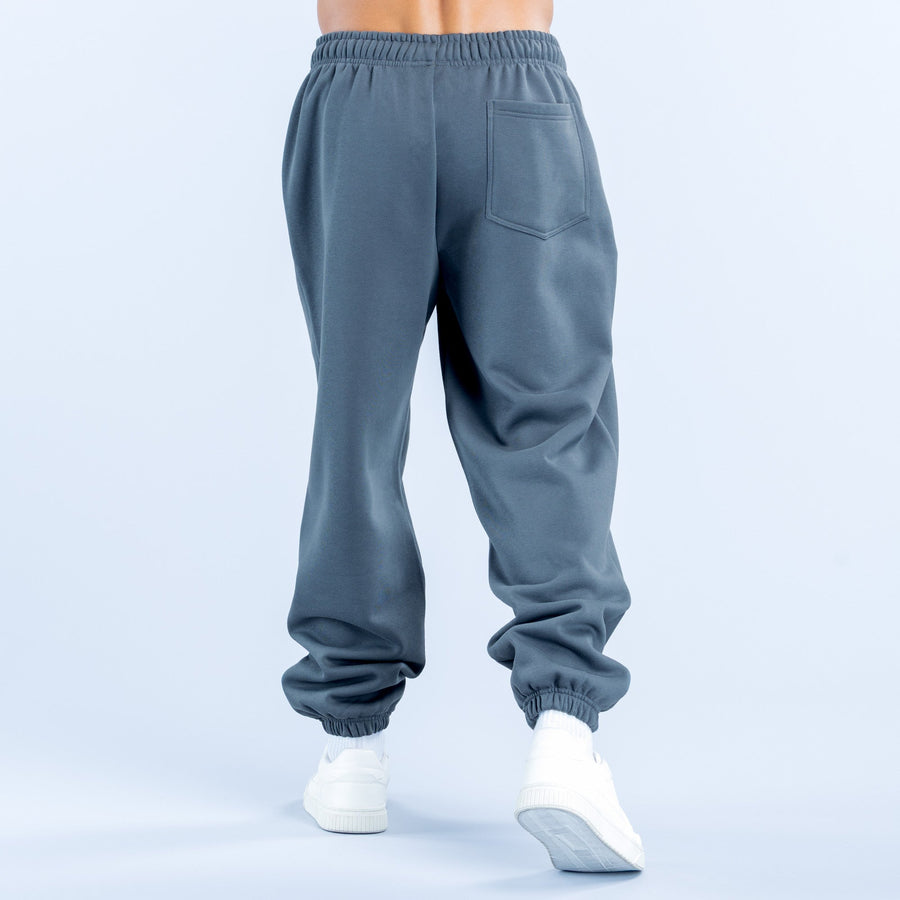 Dark blue joggers back view with elastic waistband and back pocket detail
