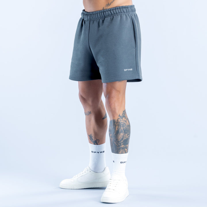 Recharge shorts in dark blue with elastic waistband and small logo on right thigh.