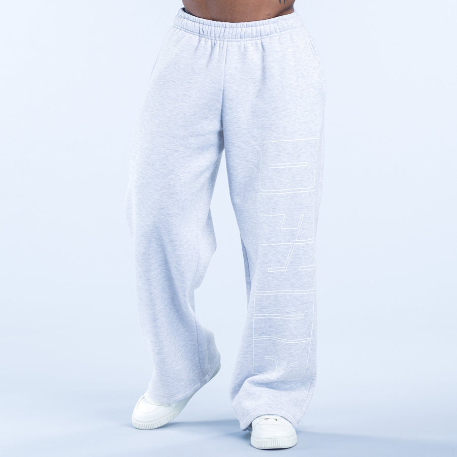 Light gray straight-leg joggers with elastic waistband and large front side patch graphic