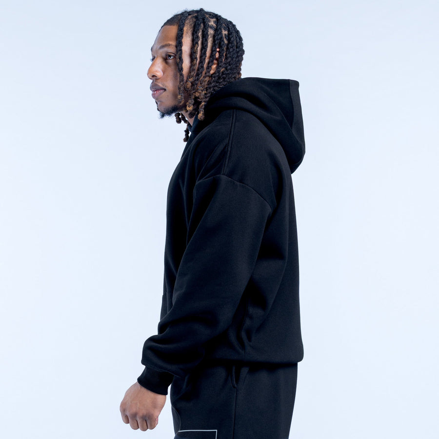 Black pullover hoodie side view with hood, long sleeves, and kangaroo pocket
