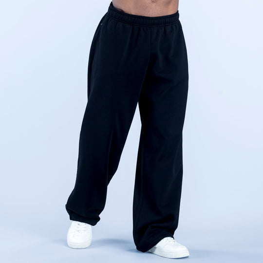Dark straight-leg joggers with elastic waistband and relaxed fit