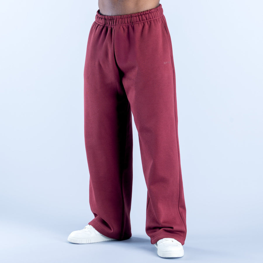Maroon straight-leg joggers with elastic waistband and side pockets