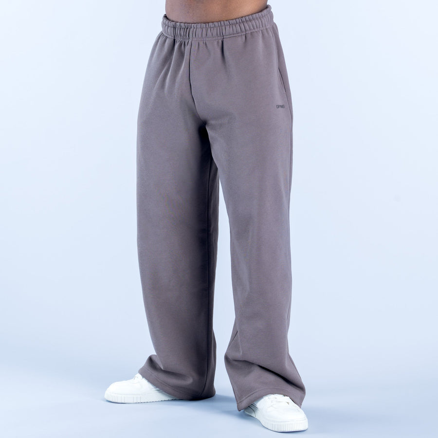 Dark gray joggers with relaxed straight legs, elastic waistband, and tapered cuffs
