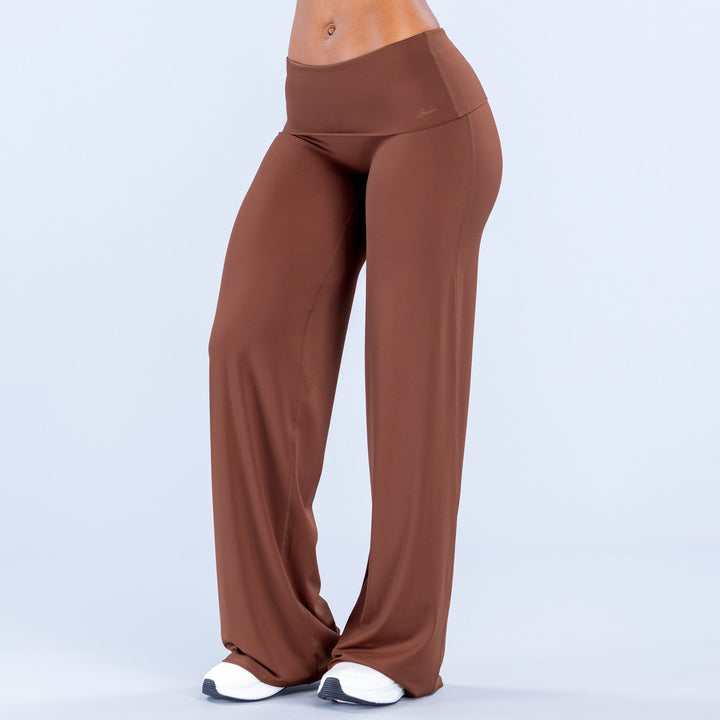 Rust wide-leg pants with fold-over waistband and relaxed straight legs