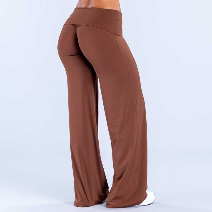 Rust wide-leg pants with fold-over waist, smooth drape and long flared legs