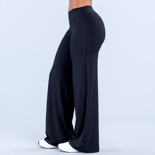 Wide-leg pants in dark black, back view with high-rise waistband and flowing flare.