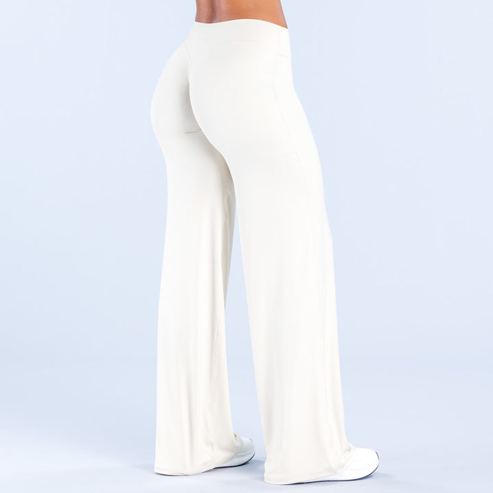 Women's off-white wide-leg pants front three-quarter view with smooth, wide pant legs