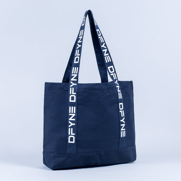 Navy canvas tote bag with front logo strip and two webbing top handles