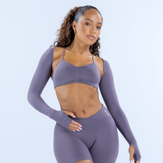 Women’s long-sleeve athletic shrug in mauve purple, cropped fit over sports bra